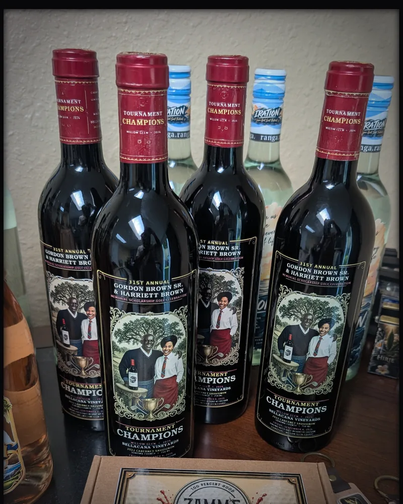 Bottles with Tournament Champions labels behind a presentation box