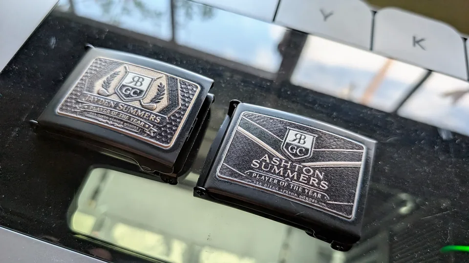 Two finished name buckles engraved for Jayden and Ashton Summers